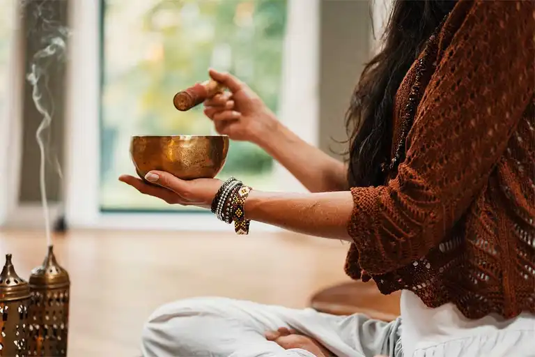 Woman holding a singing bowl